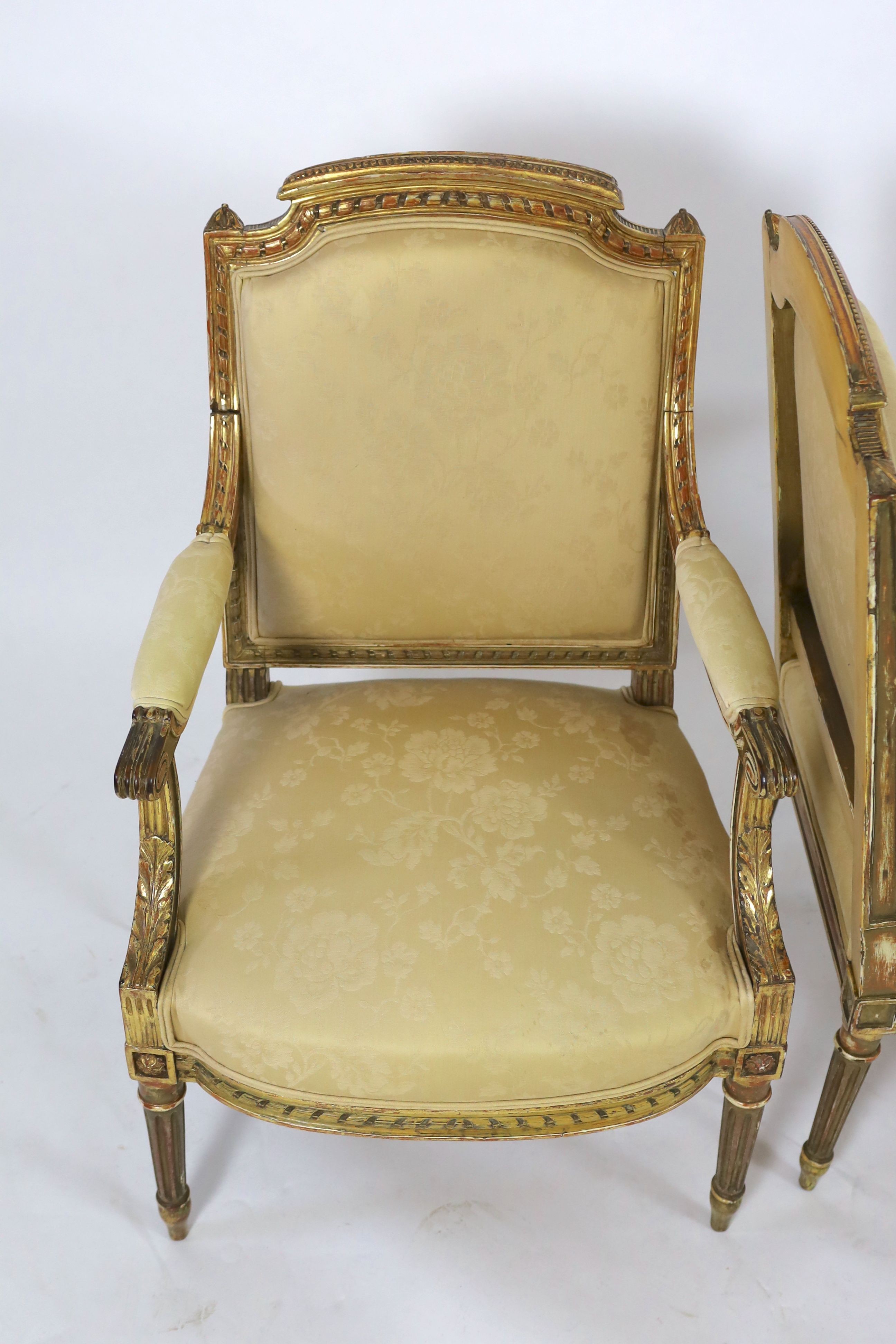 A good pair of 19th century French gilt wood elbow chairs 101 cm high, 62cm wide.